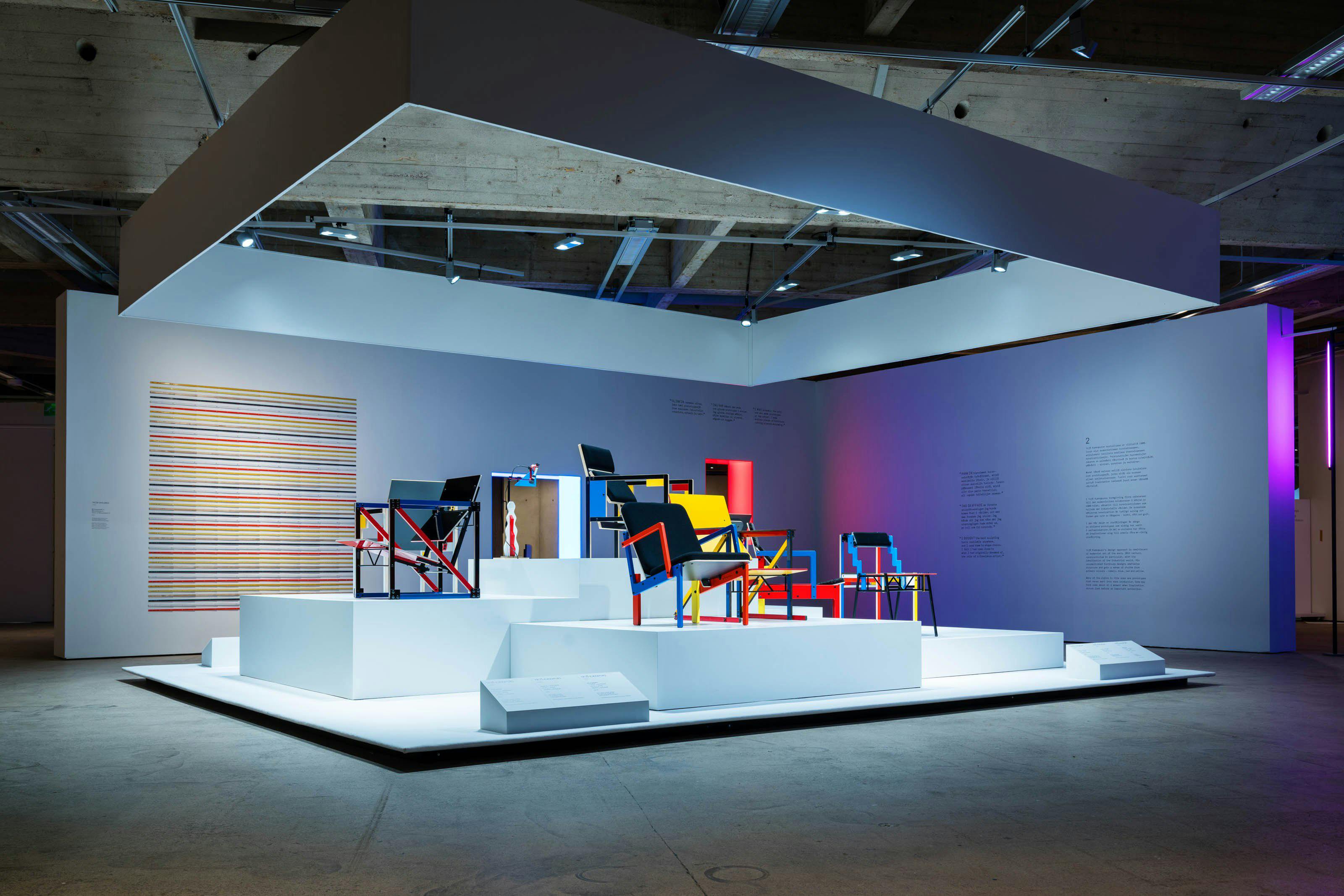 An installation view of a work by Jacob Dahlgren and a plinth with modernist style chairs