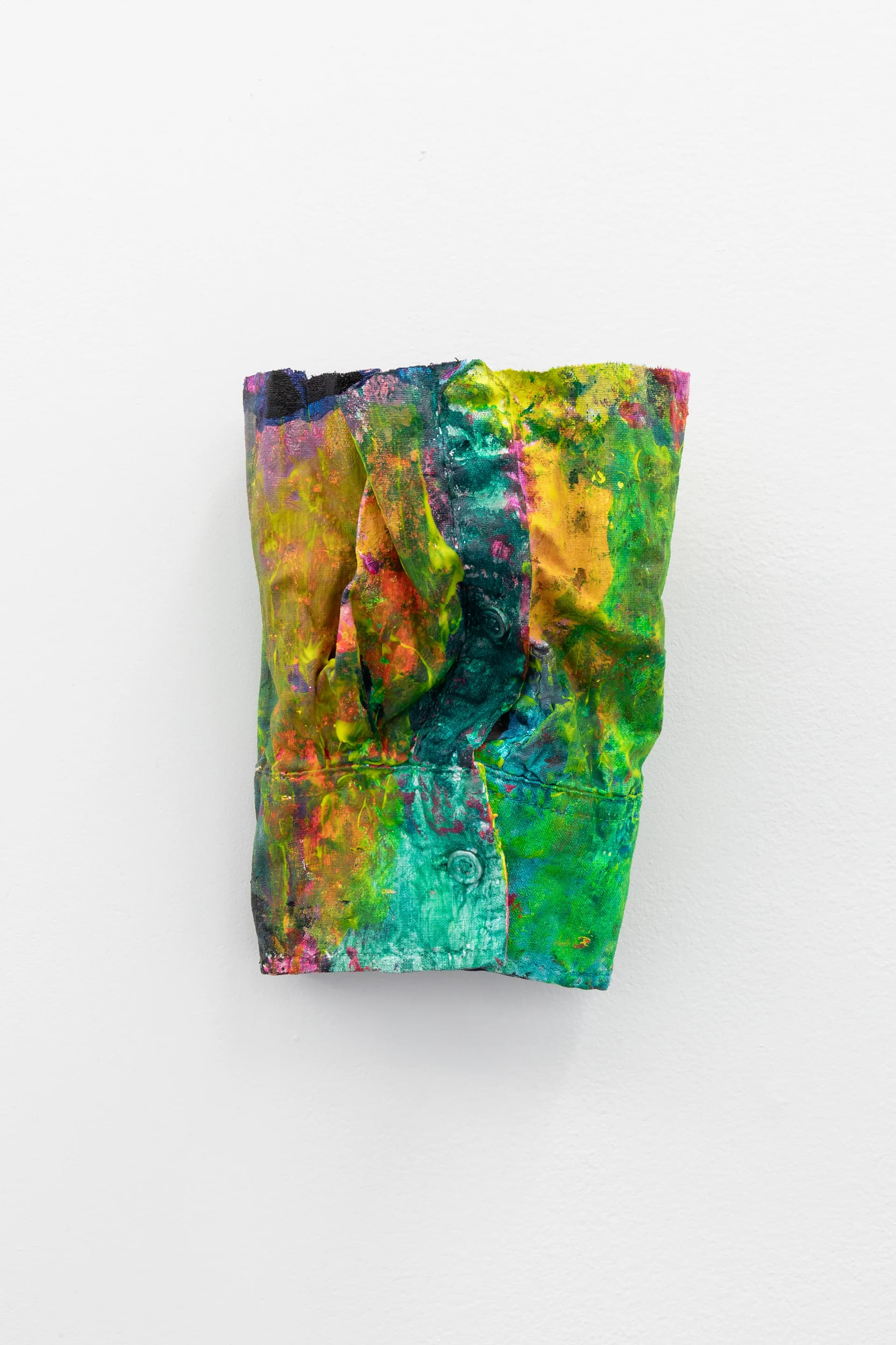 Artwork by Hayley Tompkins, cut off sleeve covered in brightly coloured paint