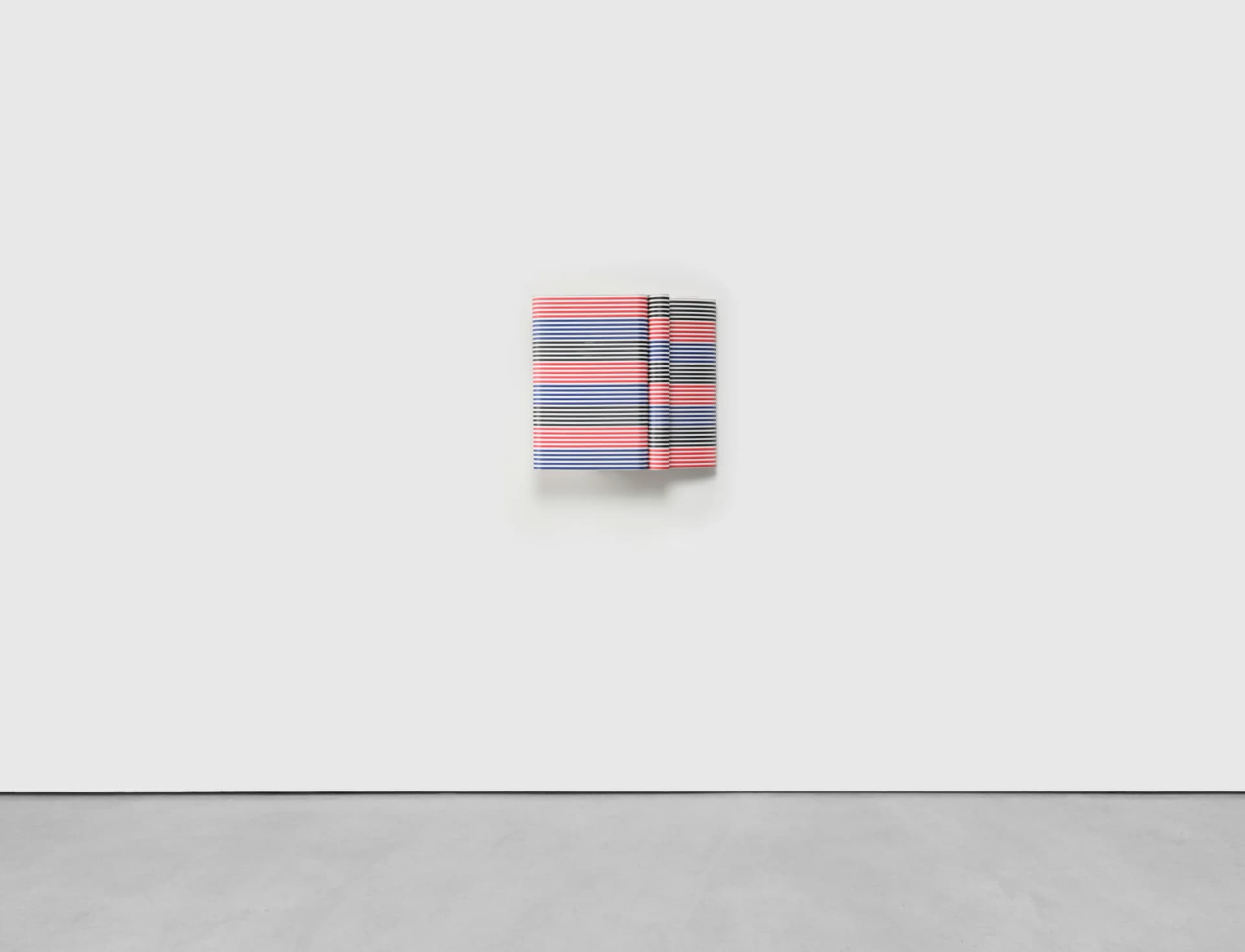 A sculptural striped wall based artwork by Jacob Dahlgren made of tessellated plastic coat hangers and aluminium.