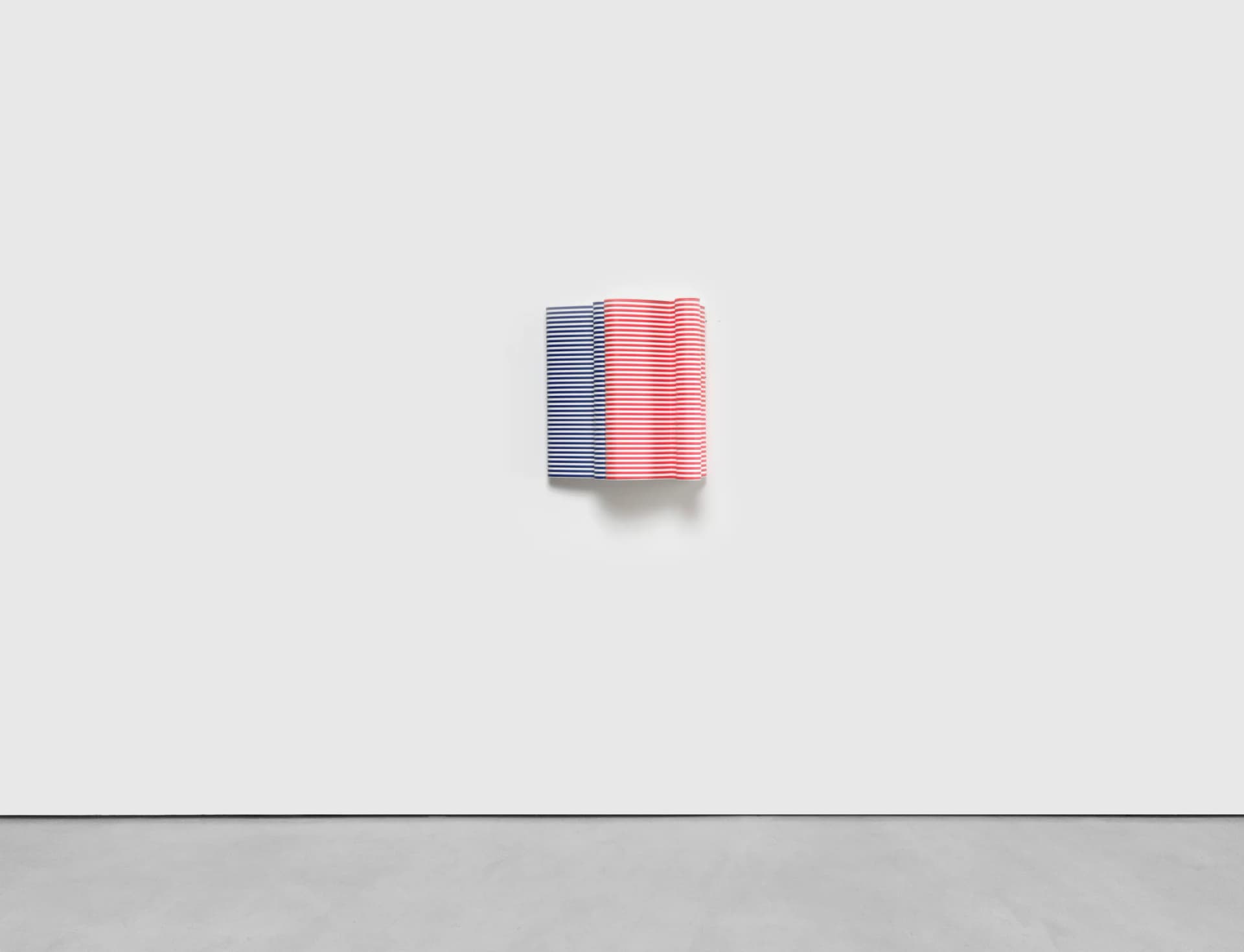 A sculptural striped wall based artwork by Jacob Dahlgren made of tessellated plastic coat hangers and aluminium.